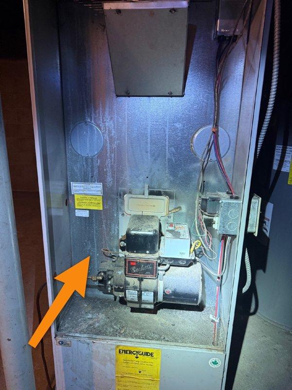 Responded to no-heat call for oil furnace at newly purchased home. Upon inspection, found unit in poor condition with heavy soot accumulation throughout system. Heat exchanger and chimney were clear, but burner nozzle (.65 80 A) and associated components were severely plugged with soot. System was missing oil filter, and pump coupler showed significant wear. Recommended full tune-up as starting point, but advised homeowners that extensive investment was not advisable given the age and neglected condition of the equipment. Homeowners elected to review replacement options before authorizing any repairs.