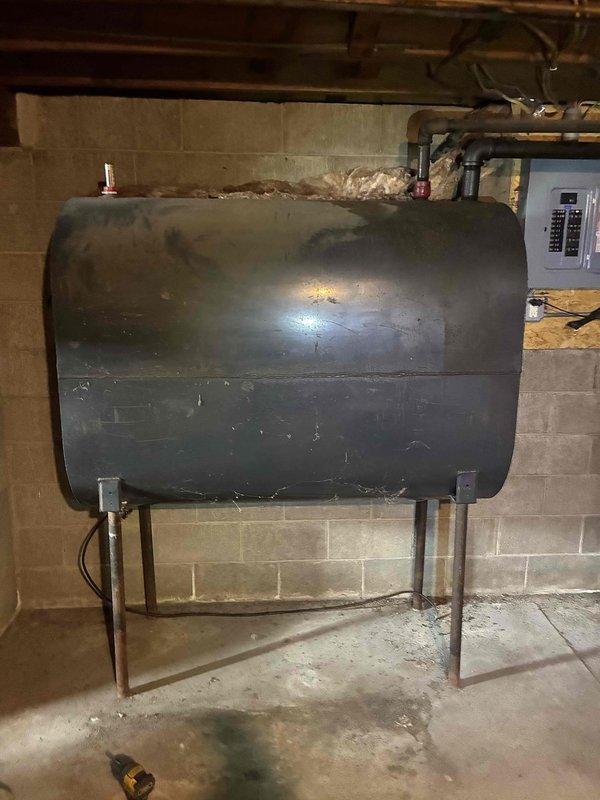 Responded to no-heat call for oil furnace at newly purchased home. Upon inspection, found unit in poor condition with heavy soot accumulation throughout system. Heat exchanger and chimney were clear, but burner nozzle (.65 80 A) and associated components were severely plugged with soot. System was missing oil filter, and pump coupler showed significant wear. Recommended full tune-up as starting point, but advised homeowners that extensive investment was not advisable given the age and neglected condition of the equipment. Homeowners elected to review replacement options before authorizing any repairs.