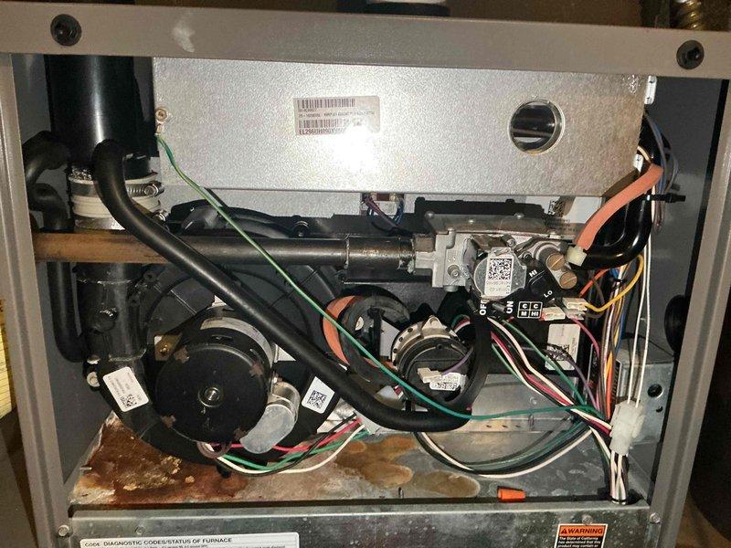 Completed comprehensive furnace tune-up on 12-year-old unit. Verified gas pressure within specification and confirmed safe CO levels in flue. Inspected heat exchanger, found clean and safe with no cracks or damage. Tested ignition components and cleaned flame sensor to ensure proper operation. All system components tested and operating within manufacturer specifications. Identified inducer draft motor leaking condensation and exhaust gases, requiring replacement for safe operation. Submitted parts order for inducer draft motor and scheduled follow-up installation upon delivery. Furnace remains fully operational in current state.