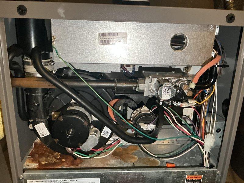 Completed comprehensive furnace tune-up on 12-year-old unit. Verified gas pressure within specification and confirmed safe CO levels in flue. Inspected heat exchanger, found clean and safe with no cracks or damage. Tested ignition components and cleaned flame sensor to ensure proper operation. All system components tested and operating within manufacturer specifications. Identified inducer draft motor leaking condensation and exhaust gases, requiring replacement for safe operation. Submitted parts order for inducer draft motor and scheduled follow-up installation upon delivery. Furnace remains fully operational in current state.