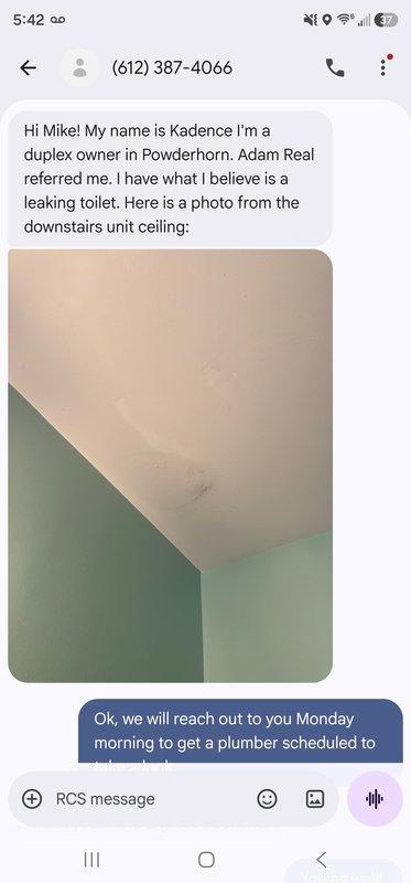 Responded to report of toilet leak in upper unit causing water damage to ceiling in lower unit of duplex. Upon arrival, conducted visual inspection of toilet installation and surrounding area. Examined ceiling damage in unit below, noting visible water staining and discoloration. Inspected toilet mounting to verify proper seal between fixture and floor flange. Toilet appeared to be properly set to floor with no obvious signs of wax ring failure or flange damage at time of inspection. Documented conditions with photographs for reference and further assessment.