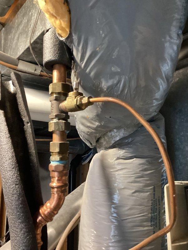 Completed comprehensive tune-up and safety inspection on a 13-year-old Bryant high-efficiency gas furnace. Performed full maintenance protocol including assessment of all system components, heat exchanger inspection, burner assembly cleaning, and verification of operational parameters. System found to be functioning within normal specifications with age-appropriate wear and tear noted. Identified leaking humidifier unit requiring replacement to maintain optimal indoor air quality and prevent water damage. Inspected copper refrigerant lines, brass valve fittings, and ductwork connections in attic installation area. Verified proper airflow through air handling unit and confirmed mesh filter condition. All safety controls tested and confirmed operational. System running effectively and ready for heating season operation.