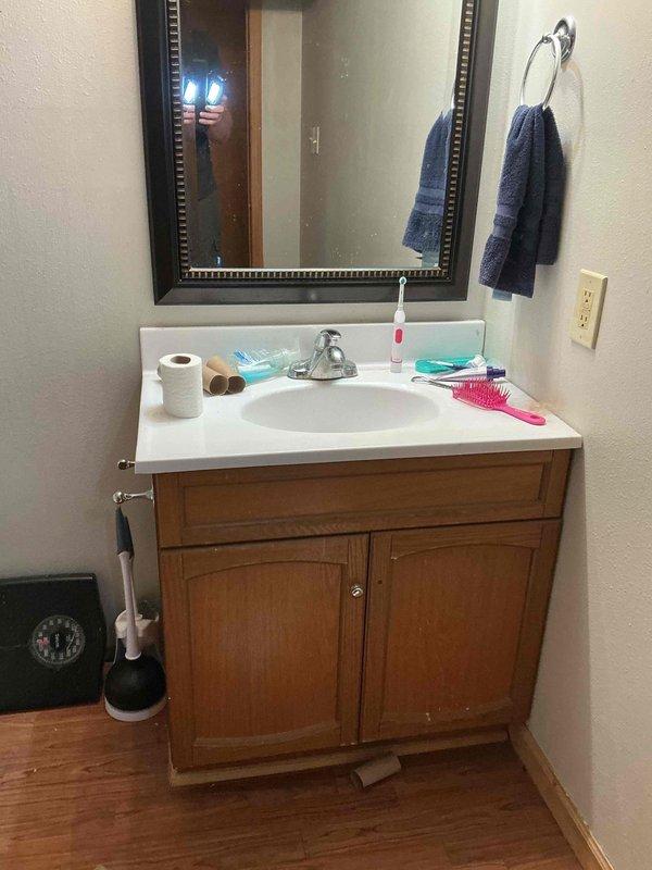 Performed plumbing inspection of finished basement bathroom to facilitate permit sign-off for property sale. Examined all plumbing fixtures including toilet, vanity faucet, and bathtub installations to verify compliance with local plumbing codes. Documented proper installation of water supply lines, drain connections, and fixture mounting to provide official certification for unpermitted work completed during basement finishing project.