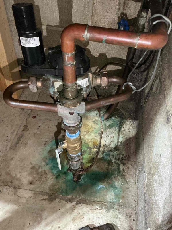 Responded to service call for water shut-off valve inspection prior to city water meter replacement. Upon initial assessment, determined existing shut-off valve required replacement due to age and condition. Returned to property to install new brass shut-off valve on main water supply line. Completed installation with proper threading and sealing, ensuring leak-free operation. Noted evidence of previous copper corrosion and mineral deposits on basement floor beneath plumbing assembly, indicating historical moisture exposure. Verified proper valve function and confirmed system integrity following installation.