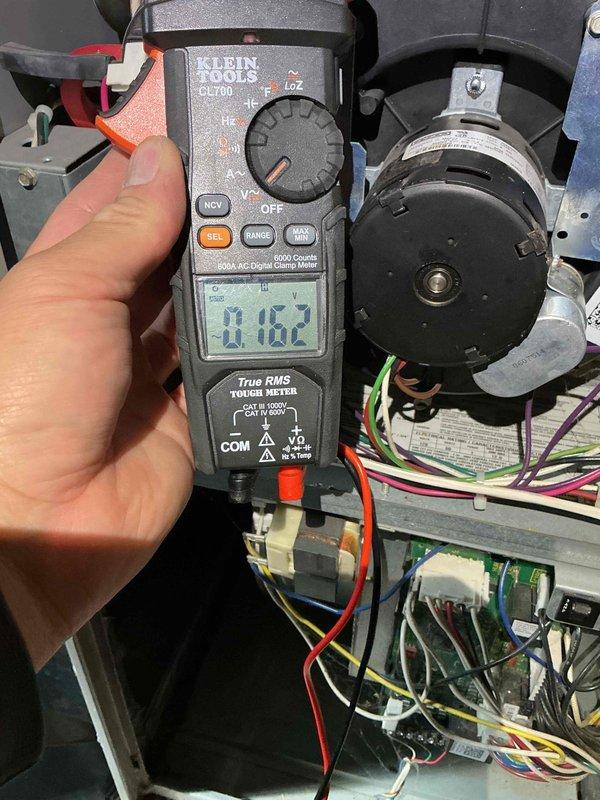 Performed routine maintenance on a 20-year-old Lennox furnace under Family Rewards Heating Visit agreement. Cleaned flame sensor and tested hot surface ignitor, which showed ohm readings slightly below specification but within acceptable operating range. Identified failed inducer motor capacitor reading 3.61µF (rated 7.5µF) with low amp draw of 0.162A. Replaced capacitor and verified proper amp draw of 0.30A post-repair. Conducted heat exchanger inspection using borescope camera inserted through burner assembly due to gas valve obstructing direct visual access to high limit switch area. No cracks or deterioration detected in visible heat exchanger sections. System tested and confirmed operational with proper heating output.