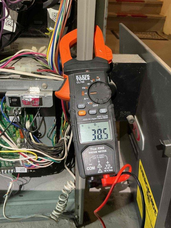 Performed routine maintenance on a 20-year-old Lennox furnace under Family Rewards Heating Visit agreement. Cleaned flame sensor and tested hot surface ignitor, which showed ohm readings slightly below specification but within acceptable operating range. Identified failed inducer motor capacitor reading 3.61µF (rated 7.5µF) with low amp draw of 0.162A. Replaced capacitor and verified proper amp draw of 0.30A post-repair. Conducted heat exchanger inspection using borescope camera inserted through burner assembly due to gas valve obstructing direct visual access to high limit switch area. No cracks or deterioration detected in visible heat exchanger sections. System tested and confirmed operational with proper heating output.
