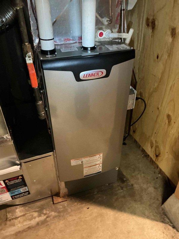 Responded to warranty call for rattling noise on newly installed Lennox furnace. Diagnosed issue as loose-fitting filter access cover vibrating during blower operation. Adjusted cover lip by bending slightly to achieve tighter fit against unit housing and applied electrical tape along edge to secure fit and prevent sharp metal edge exposure during future filter changes. Provided homeowner instruction on proper humidifier operation and settings. System tested and verified all components operating within normal parameters with no further noise issues present.