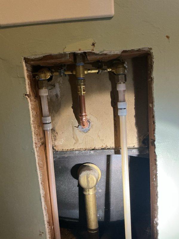 Replaced existing shower faucet with new Moen chrome 2-handle shower valve and trim assembly. Cut access openings in wall to facilitate installation of the new valve body and plumbing connections. Installed access panels at wall openings to allow for future maintenance access to the plumbing infrastructure.