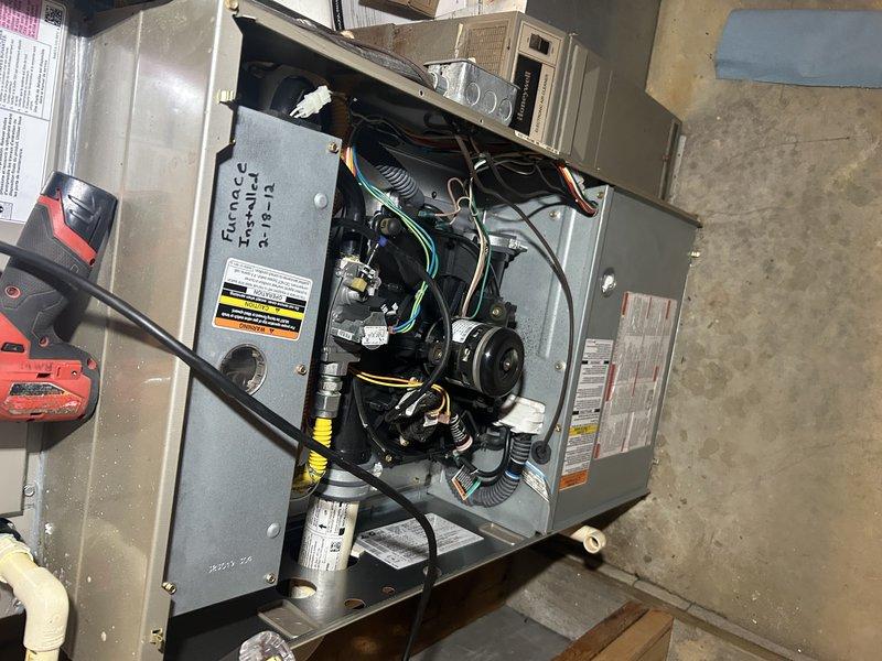 Performed pre-winter maintenance on a 10-year-old furnace system. Tested furnace operation, verified temperature rise and combustion parameters within acceptable range. Confirmed air filter was clean and cleared condensate drain line. Inspected and cleaned igniter and flame sensor. Removed blower assembly to access and inspect secondary heat exchanger, where multiple failures were discovered. Tagged out furnace due to safety concerns with heat exchanger integrity. Testing revealed weak blower capacitor reading below specification. Noted inducer motor producing abnormal noise indicating bearing wear or impeller issues. Documented all findings with photographs and provided comprehensive repair pricing options to customer. Scheduled service advisor consultation to review replacement recommendations and system options.