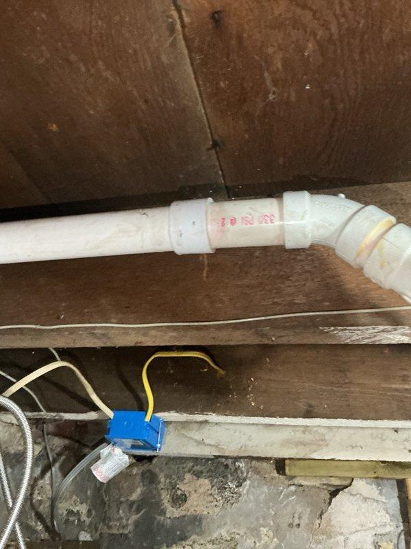 Responded to emergency plumbing call for multiple water leaks in kitchen and bathroom. Upon inspection, found kitchen sink drain pipe broken off approximately 2 feet inside wall cavity, refrigerator water supply line leaking at connection point, and toilet leaking at base due to failed wax ring seal. Secured refrigerator supply line by tightening compression fitting to stop active leak. Removed and replaced toilet wax ring seal to eliminate base leakage. Accessed wall cavity and repiped kitchen sink drain line using PVC pipe and fittings, replacing damaged section and establishing proper drainage connections. All repairs tested and verified leak-free upon completion.