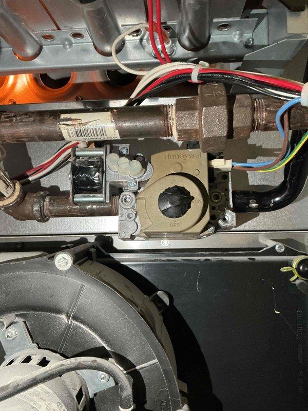 Responded to no heat call on 6-year-old furnace system blowing cold air on first use of heating season. Diagnosed two-stage gas valve malfunction where unit would initiate in first stage but fail to advance to second stage, resulting in premature shutdown and no heat output. Performed complete system inspection and component testing to verify gas valve as root cause of heating failure. Confirmed all other furnace components operating within normal parameters. Replacement gas valve ordered for follow-up installation to restore full two-stage heating operation.