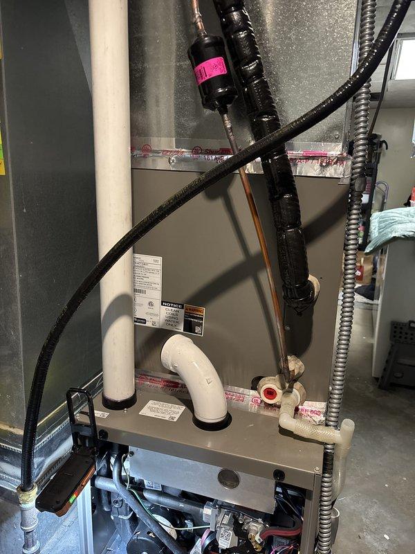Completed annual maintenance on one 2-year-old residential furnace system. Performed comprehensive inspection including thermostat operation, air filter, condensate drain, blower motor, inducer motor, capacitor, and electrical wiring—all found in satisfactory condition. Verified proper temperature split across system. Inspected heat exchanger, igniter, and flame sensor with no issues noted. Measured gas pressure and found it slightly elevated; adjusted gas pressure to manufacturer specifications. Identified potential water leakage at exhaust vent coupling and tightened connection to resolve issue. System is operating within normal parameters at time of service completion.