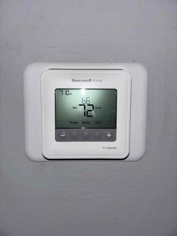 Completed annual maintenance on one 2-year-old residential furnace system. Performed comprehensive inspection including thermostat operation, air filter, condensate drain, blower motor, inducer motor, capacitor, and electrical wiring—all found in satisfactory condition. Verified proper temperature split across system. Inspected heat exchanger, igniter, and flame sensor with no issues noted. Measured gas pressure and found it slightly elevated; adjusted gas pressure to manufacturer specifications. Identified potential water leakage at exhaust vent coupling and tightened connection to resolve issue. System is operating within normal parameters at time of service completion.