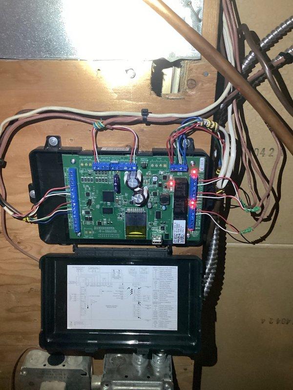Responded to service system alert with Alarm ID 411 indicating outdoor unit low pressure switch strikes lockout. Upon arrival, system was non-operational with thermostat displaying error codes causing air conditioning lockout. Performed diagnostic inspection of thermostat, zone control system, and furnace components. Identified heavily clogged condenser coil obstructed with pollen accumulation as primary cause of system failure. Cleared all error codes from thermostat and control board. Thoroughly cleaned outdoor condenser coil to restore proper airflow and heat exchange capacity. Cycled system through multiple operational sequences to verify proper function across all zones. Set all zones to off position and confirmed system returned to normal operation with no recurring errors or lockouts.