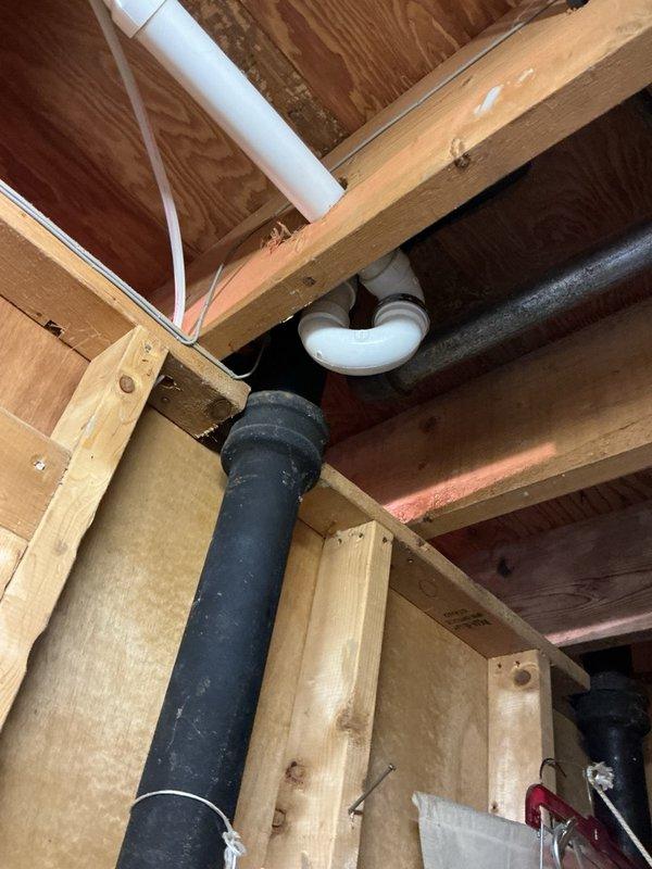 Responded to water leak emergency in kitchen area where active dripping was occurring through drop ceiling onto floor and ductwork below cabinet. Upon investigation, located pinhole leak in copper water supply line beneath kitchen sink. Removed damaged section of copper pipe and replaced with PEX tubing using appropriate fittings and connections. Tested system for proper water flow and verified no additional leaks present. Restored water service to affected area.