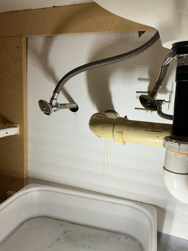 Responded to a leaking shut-off valve under a bathroom sink. Upon inspection, found the existing valve was both leaking and stuck in position, preventing proper water control. Replaced both hot and cold water supply stops with new chrome-finished shut-off valves to restore full functionality and eliminate the leak. Tested the new valves to ensure proper operation and verified no additional leaks were present.