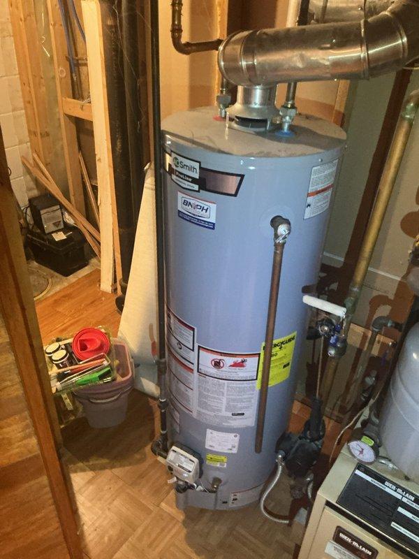 Responded to a no hot water complaint on a residential tanked water heater. Upon arrival, inspected the unit and verified customer reports of cold water at fixtures. Performed diagnostic testing on the water heater system, checking thermostat settings, power supply connections, and heating element functionality. Determined the water heater was operating within normal parameters with no mechanical or electrical failures detected. Confirmed hot water delivery was restored to all fixtures including shower. System returned to full operational status with no repairs required.