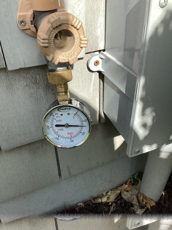 Responded to no water pressure complaint affecting entire home. Upon inspection, discovered LeakSense water management system flow control was in the off position, preventing water flow throughout the property. Restored full water pressure by turning the Watts flow control back to the on position. System pressure gauge readings confirmed normal operation upon completion.