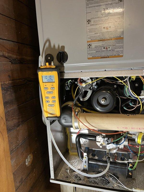 Completed comprehensive tune-up inspections on two furnace systems—one serving the main house (2020 model) and one serving the shop area. Performed routine maintenance checks on all critical components including gas pressure measurement, blower motor operation, electrical connections, and heat exchanger inspection. Gas pressure readings measured slightly low at 10.1-10.2 inches water column; attempted adjustment but unable to reduce further while remaining within acceptable operating parameters. Conducted full operational testing with each system running for 15 minutes under load conditions. Main house furnace demonstrated proper performance with 70°F temperature rise across heat exchanger. Shop furnace operated correctly with 45°F temperature rise. All safety controls, ignition systems, and ventilation components verified to be functioning within manufacturer specifications. Both systems cleared for continued operation with no immediate concerns identified.