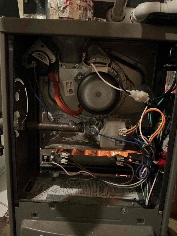 Replaced the PSC draft combustion inducer blower assembly, including the inducer draft motor, on the gas furnace. Reconnected the wiring harness and pressure switch hose, then cycled the unit through a full heating sequence to confirm proper inducer operation, ignition, and burner flame. The furnace is fully operational.
