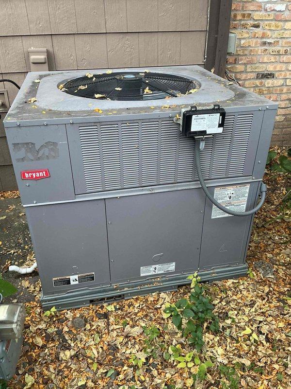 Performed annual fall heating tune-up on one ground-mounted Bryant packaged rooftop unit (RTU), including inspection of the cabinet, condensate drain, electrical disconnect, and condenser fan area, and verified operation with a dual-port manometer to check pressure readings. No issues were found, and the unit was left operating normally.