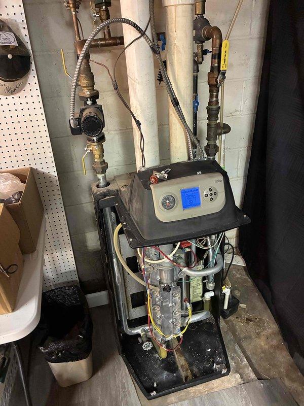 Performed annual preventive maintenance on a 17-year-old boiler, including inspection and cleaning of routine components with the cabinet panels removed for access. System was verified to be operating as designed, with no deficiencies found.