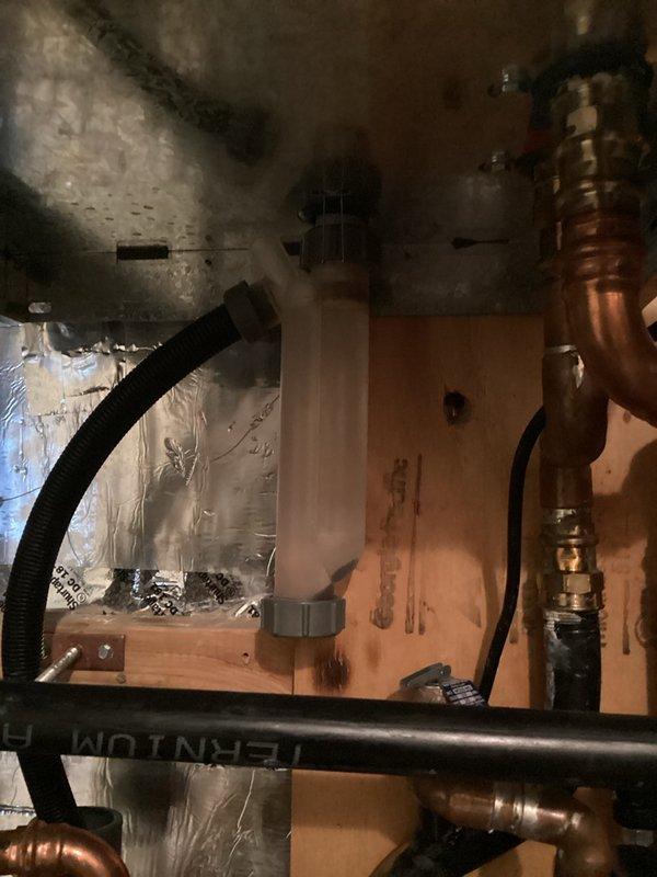 Opened the previously isolated basement in-floor heating loop and verified proper operation, then inspected the boiler system and set system water pressure to 17 psi. The system was found operating normally, and the homeowner will monitor performance and report any changes. Discussed adding a mixing valve for the in-floor loops as a future improvement.