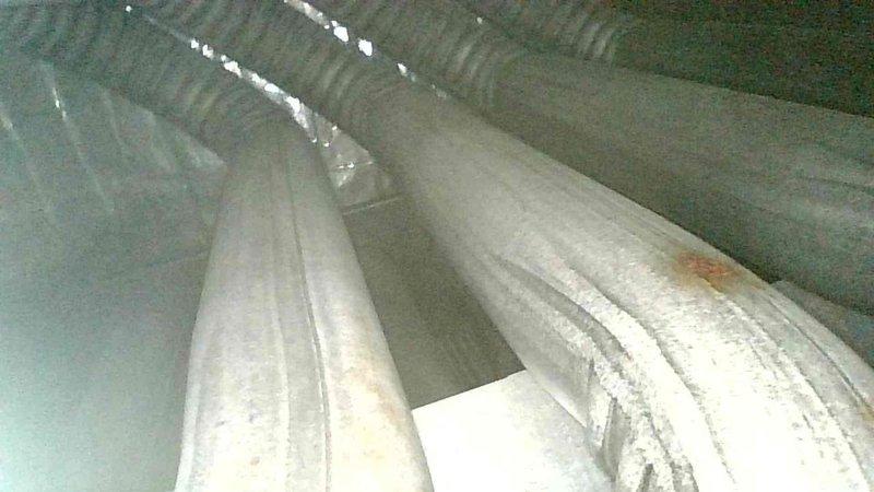 Responded to a no-heat call on a 2003 furnace and diagnosed a malfunctioning control board, an inducer motor drawing high amperage, and an ignitor with a failed resistance reading. Inspection of the heat exchanger and flue components revealed surface corrosion and rust, and the unit is at or beyond its 15-20 year expected service life, so repair versus replacement options were recommended.