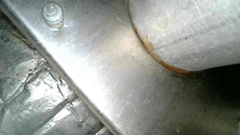 Responded to a no-heat call on a 2003 furnace and diagnosed a malfunctioning control board, an inducer motor drawing high amperage, and an ignitor with a failed resistance reading. Inspection of the heat exchanger and flue components revealed surface corrosion and rust, and the unit is at or beyond its 15-20 year expected service life, so repair versus replacement options were recommended.