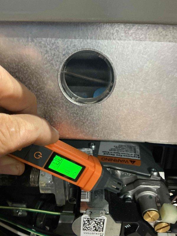 Performed annual heating tune-up on one gas furnace, inspecting the burner compartment and gas valve assembly and verifying combustion and operating performance with a handheld meter. Measured supply-side temperature at the ductwork (131.1°F) to confirm proper heat output. No issues were found, and the unit is operating normally.