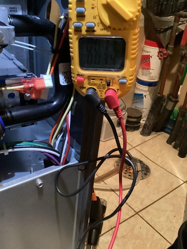 Performed annual maintenance tune-up on a one-year-old forced air furnace, including inspection of the cabinet interior, wiring, and ductwork connections. Used a digital multimeter to test electrical components and a probe thermometer to verify temperature performance. No frost, rust, or visible damage was observed, and the system was found to be operating normally with no issues requiring repair.