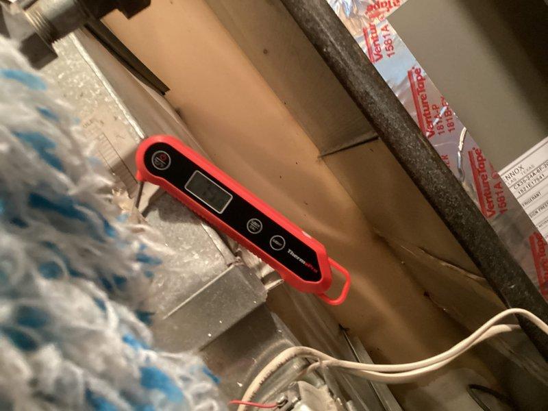 Performed annual maintenance tune-up on a one-year-old forced air furnace, including inspection of the cabinet interior, wiring, and ductwork connections. Used a digital multimeter to test electrical components and a probe thermometer to verify temperature performance. No frost, rust, or visible damage was observed, and the system was found to be operating normally with no issues requiring repair.