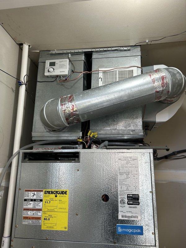 Performed a full seasonal maintenance tune-up on a Magic-Pak gas furnace, inspecting the burners, flame sensor, igniter, pressure switch, and induction blower motor, and verifying proper amp draw. Cleaned the filtration, confirmed carbon monoxide levels were within safe limits, and adjusted gas pressure to the manufacturer's specified reading. The unit was left operating properly with all components clean and intact.