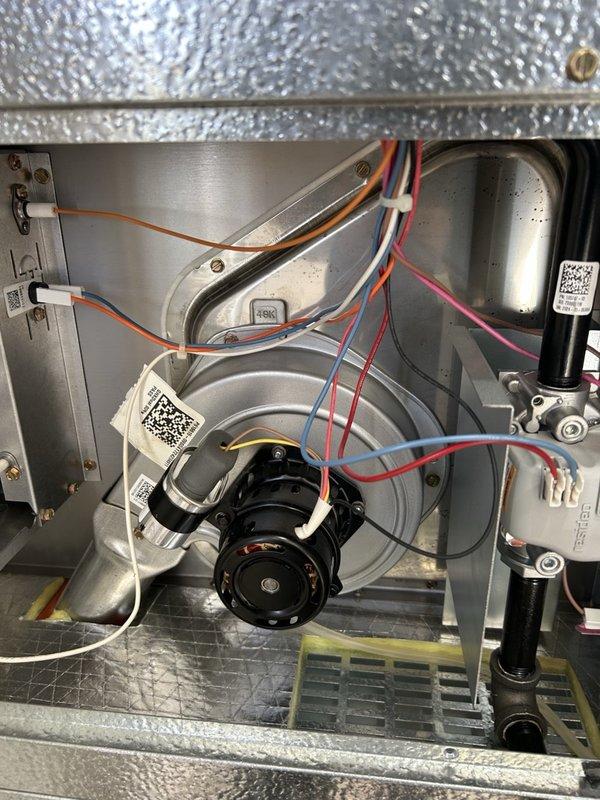 Performed a full seasonal maintenance tune-up on a Magic-Pak gas furnace, inspecting the burners, flame sensor, igniter, pressure switch, and induction blower motor, and verifying proper amp draw. Cleaned the filtration, confirmed carbon monoxide levels were within safe limits, and adjusted gas pressure to the manufacturer's specified reading. The unit was left operating properly with all components clean and intact.