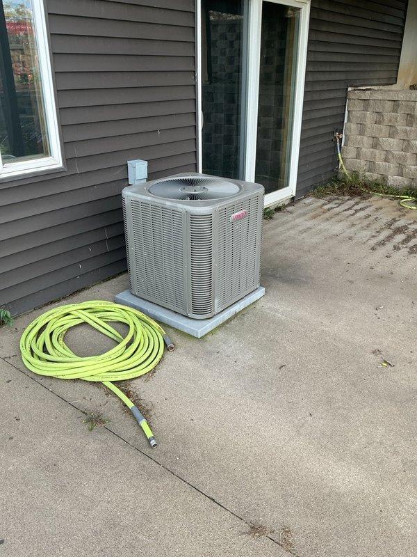 Responded to a no-cool complaint on a 10+ year old Lennox split system with a history of a frozen indoor coil and a previously suspected refrigerant leak at the A-coil. Connected a digital manifold gauge set to the condenser and checked system pressures, which indicated a low refrigerant charge, though current ambient conditions prevented a conclusive charge verification. Recommended either replacing the A-coil or adding refrigerant and performing a leak check, with a recheck of charge on a sunny day around 70°F.