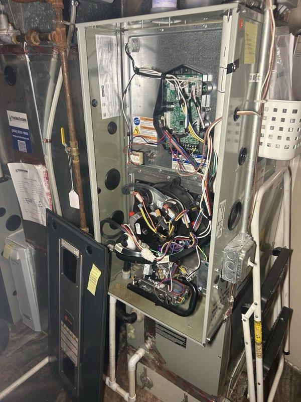 Returned to replace the gas valve wiring harness on the lower-level furnace as part of a sold repair. Removed the front access panel and inspected the gas valve terminal block and associated wiring, and determined the supplied replacement harness was incorrect for this unit, so the replacement could not be completed. The correct harness will be re-ordered and the part forms completed to schedule a return visit; the furnace was left with its original wiring in place.