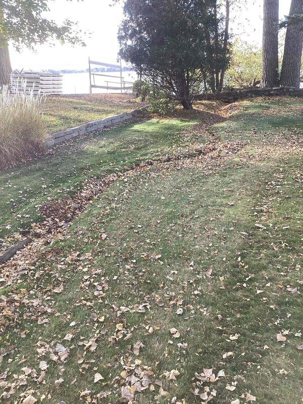 Responded to a callback for a sump pump alarm that continued sounding after prior visits. Found the primary float stuck in position and the secondary float set too low, causing false alarm triggers. Cleared the primary float and repositioned the secondary float to eliminate the nuisance alarm. Verified the discharge line terminates properly on the exterior grade and drains freely away from the structure.