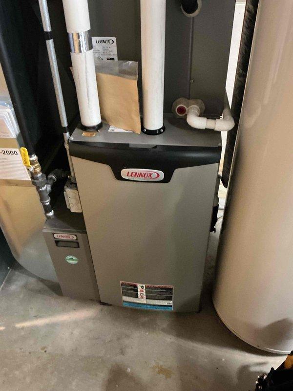 Performed a full tune-up on a 12-year-old Lennox gas furnace, verifying ignition and flame safety, gas valve operation, amp draws, capacitor, control board, heat exchanger integrity, combustion analysis, and temperature rise, all within specification, and replaced the air filter. Inspection found a failed draft inducer motor housing seal leaking condensate into the furnace cabinet, with a borescope inspection documenting frost-like buildup and moisture on interior metal surfaces. Reviewed repair options with the customer and submitted the repair proposal by email.
