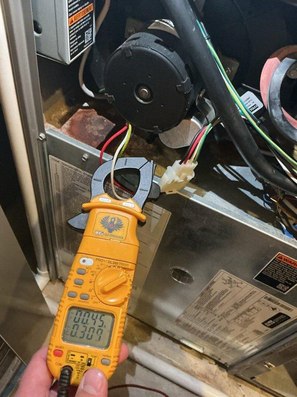 Performed a full tune-up on a 13-year-old gas furnace. Gas pressures verified in low and high fire, flue CO levels safe, and ignitor and flame sensor tested within spec (flame sensor cleaned); blower motor, control board, and remaining components tested within spec. Found the inducer draft motor housing separated and leaking condensation into the upper cabinet, with resulting rust and corrosion. Also identified a seam on the heat exchanger that may be cracked, though a through-crack could not be confirmed; photos documented for comparison at the next tune-up. The furnace is currently operational, with inducer and heat exchanger replacement (or furnace replacement) recommended.