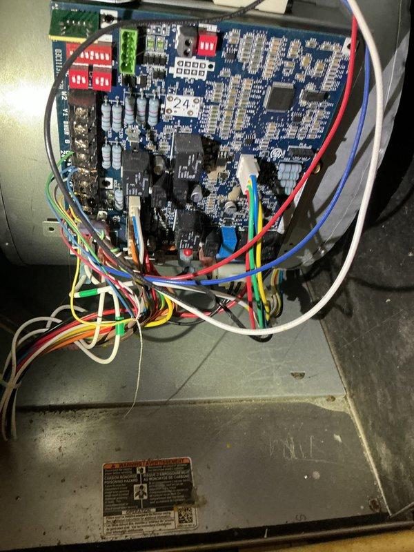 Performed annual maintenance and tune-up on a 13-year-old furnace, which was found to be in good condition for its age. Inspected the control board and wiring and noted a frayed loose wire end near the lower portion of the board. Used a borescope to inspect the blower wheel, which showed early debris buildup, and cleaned the blower wheel to restore proper airflow.