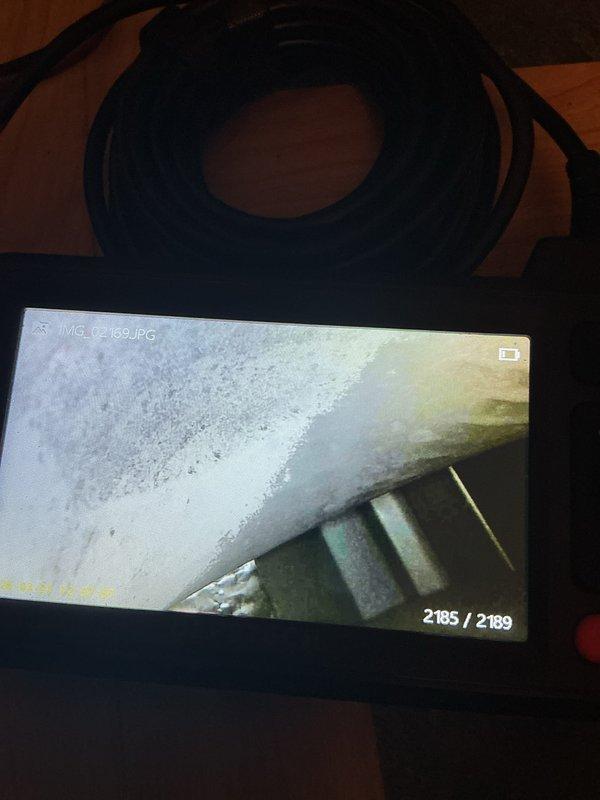 Performed annual maintenance and tune-up on a 13-year-old furnace, which was found to be in good condition for its age. Inspected the control board and wiring and noted a frayed loose wire end near the lower portion of the board. Used a borescope to inspect the blower wheel, which showed early debris buildup, and cleaned the blower wheel to restore proper airflow.