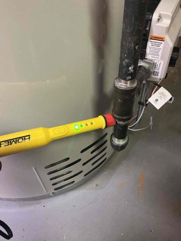 Responded to a callback for a strong gas odor at a newly installed water heater. Using a combustible gas detector, traced the leak to the flare nut at the heater's gas connection, then tightened the nut and replaced the flare end on the connector. Re-tested the fitting with the detector and confirmed no gas leakage remained.