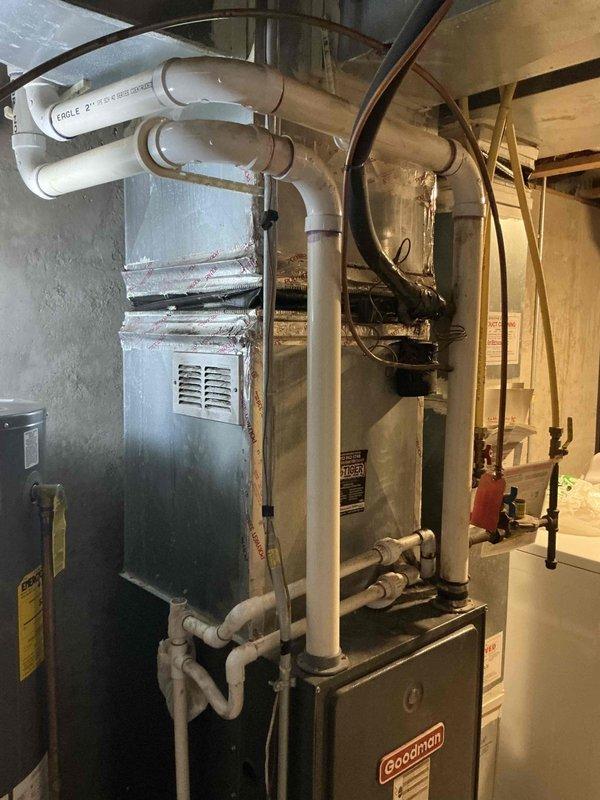 Inspected a Kenmore 520 water softener in a roughly 20-year-old home displaying an Error 1 code, with the brine basin full of water and not draining, and evaluated it as a possible source of the leak flagged by the utility company. Documented the unit's condition, which showed no visible rust or external leakage, and prepared an estimate for water treatment repair or replacement.