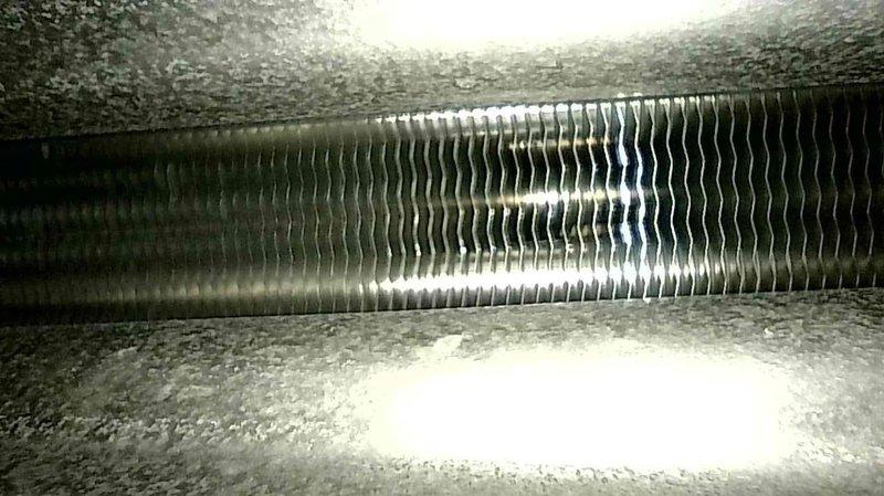 Performed a heating maintenance inspection on a 2-year-old furnace, testing the thermostat, filter, condensate drain, blower and inducer motors, capacitor, wiring, heat exchanger, igniter, flame sensor, gas pressure, temperature split, and CO levels, all within normal operating parameters. Cleared leaves obstructing the concentric vent to restore proper airflow, and noted a temperature split slightly above manufacturer specifications, likely due to closed basement supply vents. Advised the homeowner to keep all vents open to prevent overheating; the system is operating normally.