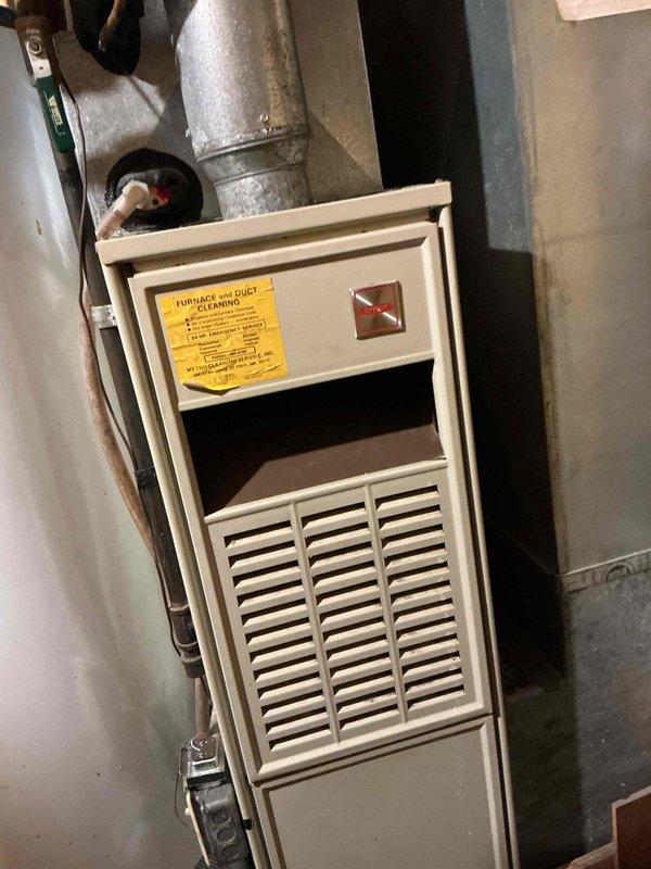Responded to a no-heat call on a 40-year-old Carrier forced-air gas furnace and diagnosed a failed heat fan relay (HFR) on the control board, which prevented the blower from operating in "auto" mode from the thermostat. Because the relay is soldered directly to the board, the repair requires full control board replacement. Verified burner ignition and flame operation at the gas valve and manifold, and documented the unit's condition and the required repair.