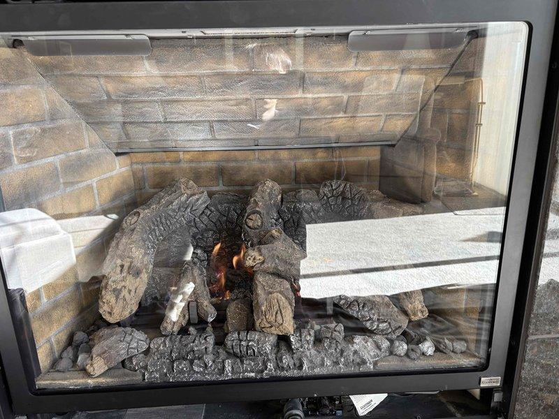 Performed maintenance on two gas fireplaces, including inspection and cleaning of the pilot assembly, glass, ceramic logs, and embers, and verification of wiring and gas valve operation. Carbon monoxide levels were within acceptable limits, and both units are operating normally. Advised the homeowner that this was the final fireplace maintenance provided by our company and recommended a dedicated fireplace service provider for future visits.
