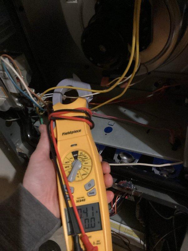 Responded to a no-heat call on a 10+ year old furnace that was locked out with a red fault light and would not respond to a reset. Diagnosed a blocked pressure switch port as the cause of the failure to initiate the heat cycle, cleared the obstruction, and restored normal operation. Performed the requested routine maintenance, including a combustion analysis through the flue (CO 16 ppm, 26.0% stack loss, 95.7% excess air) and an electrical check of the blower circuit with a clamp meter.