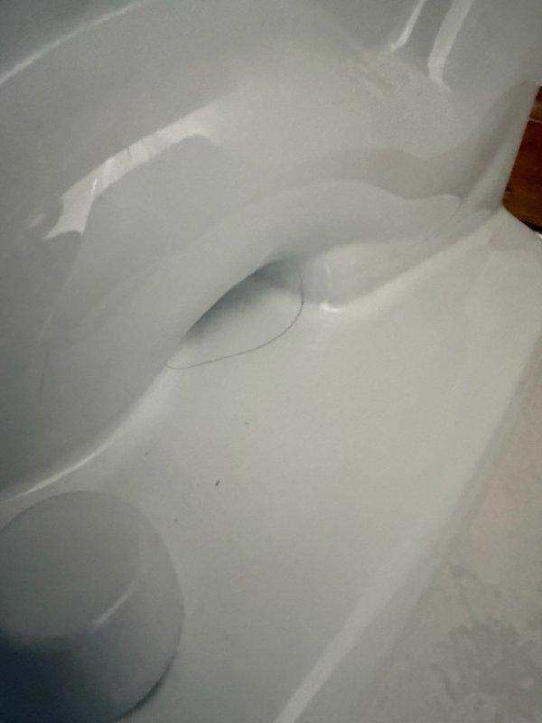 Responded to a callback on a newly installed Toto toilet that had a cracked base and was leaking. Removed the defective base and replaced it with the correct unit, then confirmed the leak was resolved. A replacement base was ordered to complete the correction.