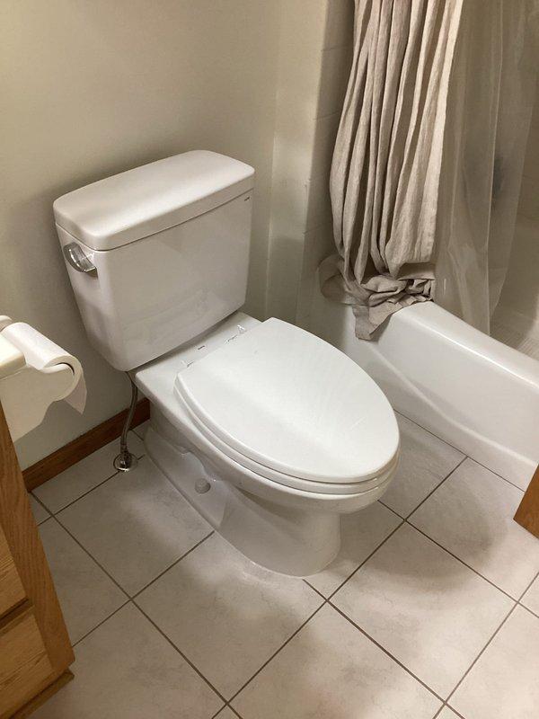 Responded to a callback on a newly installed Toto toilet that had a cracked base and was leaking. Removed the defective base and replaced it with the correct unit, then confirmed the leak was resolved. A replacement base was ordered to complete the correction.