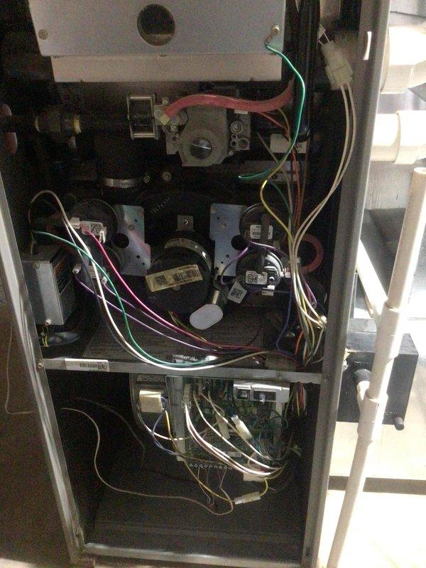 Responded to a no-heat call on a 20-year-old propane furnace. The unit cycled through its startup sequence but failed at the igniter stage. Verified correct supply voltage to the control board, but output voltage to the hot surface igniter was out of spec, confirming a failed control board. Replaced the control board, restoring proper ignition output and heat operation.